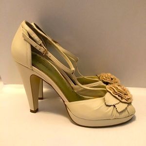 BCBGirls nude/cream leather T-strap peep toe pumps